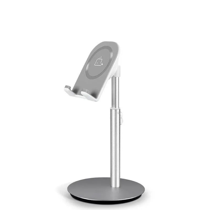 Silver metal computer phone holder stand for smartphones and tablets on a desktop.
