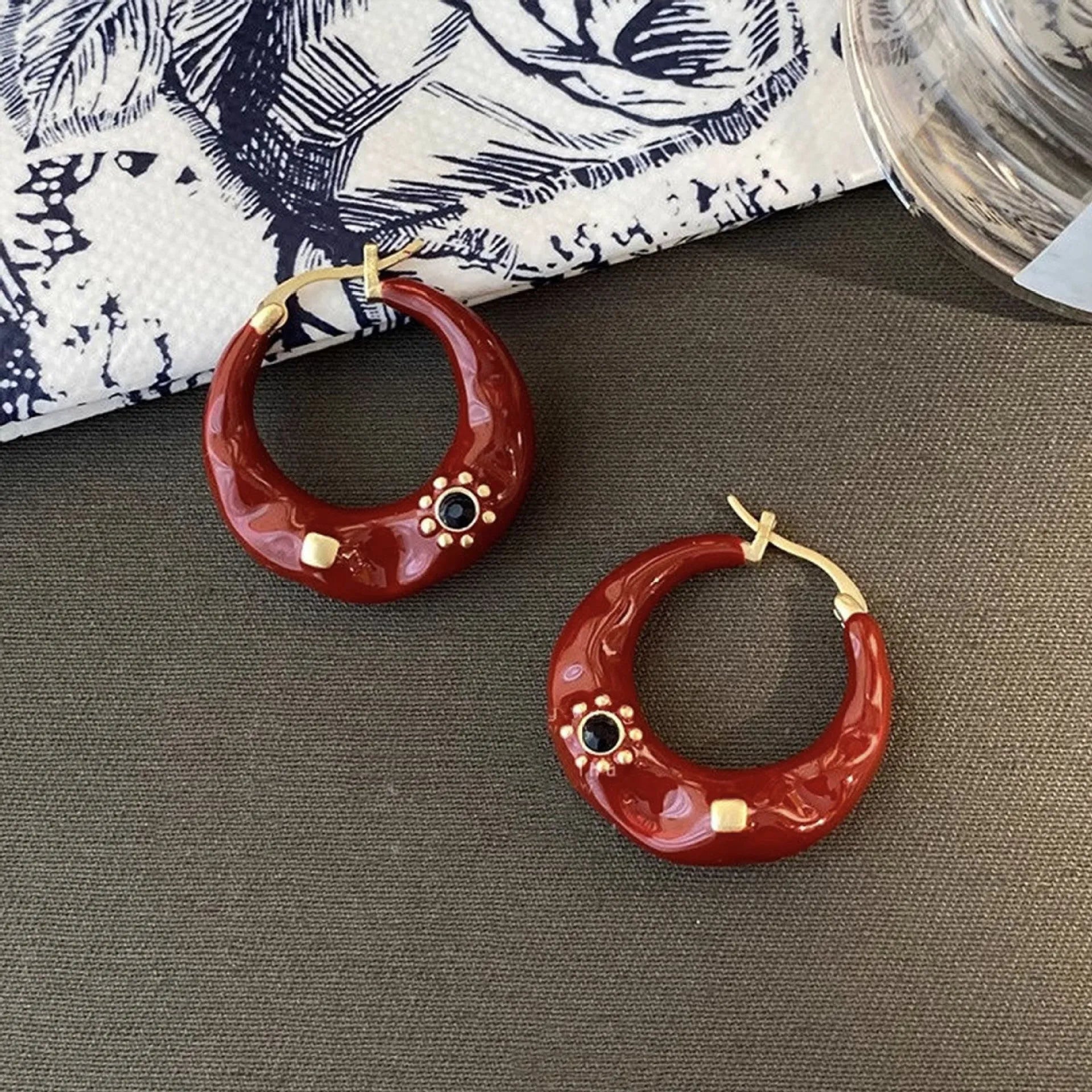 Hong Kong style retro ear studs with dripping oil texture and rhinestone decoration in black or red colour options