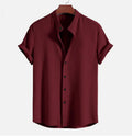 Mans loose-fitting short sleeve casual shirt in solid colour on hanger.