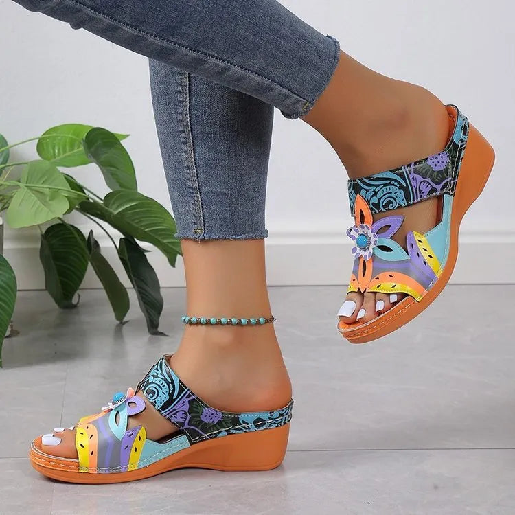Colourful women's ethnic design slippers with cowhide upper and rubber sole.