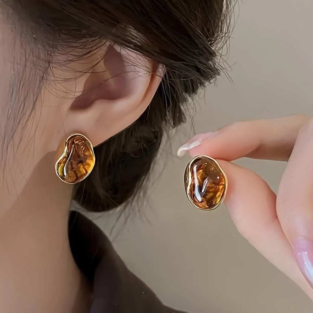 Three pairs of handmade geometric alloy earrings with tassels in Maillard, Amber, and Tigereye styles.