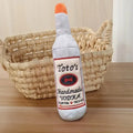 Brown plush wine bottle shaped dog toy with squeaker
