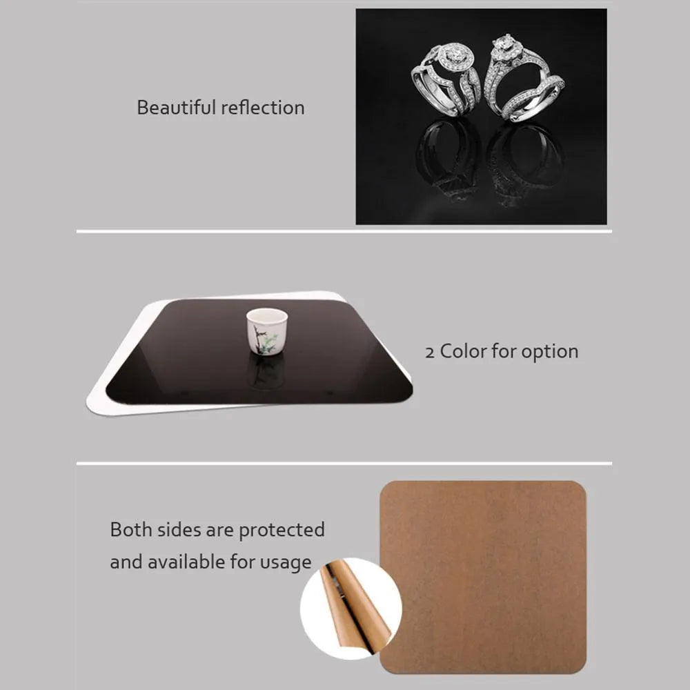 Square black and white acrylic reflection boards for photography in three different sizes.