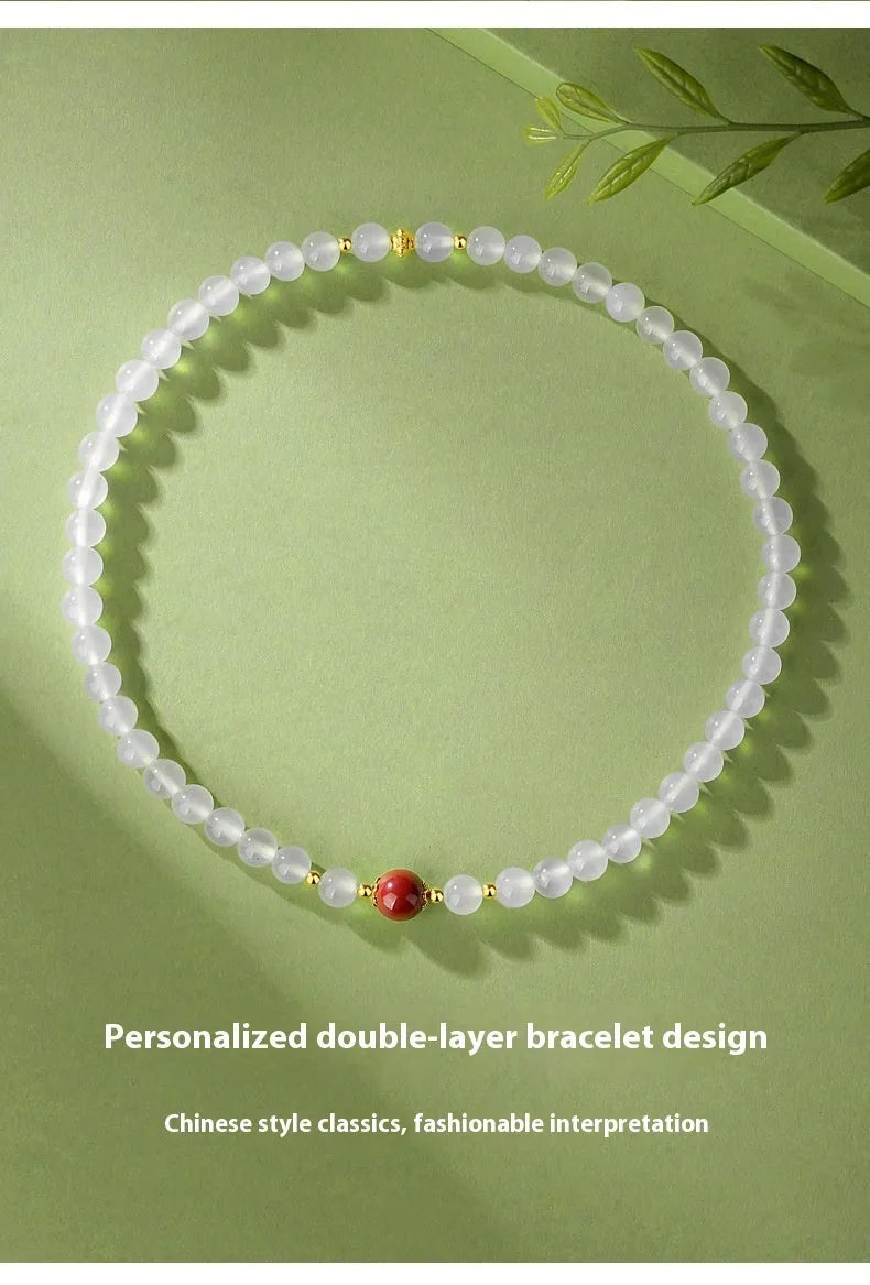 Women's double layer bracelet with white agate geometric beads and Jequirity bean cinnabar accents