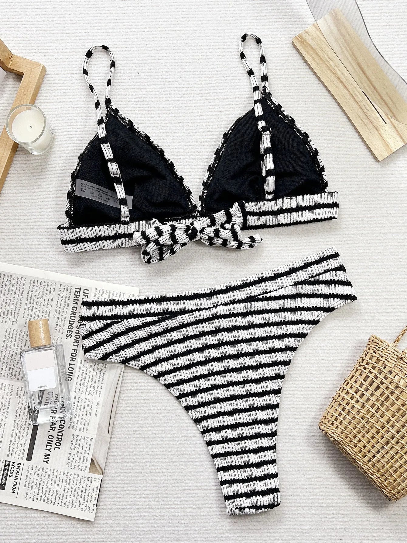 Women's black and white contrast separated bikini set on model, briefs style bottom, solid colour design