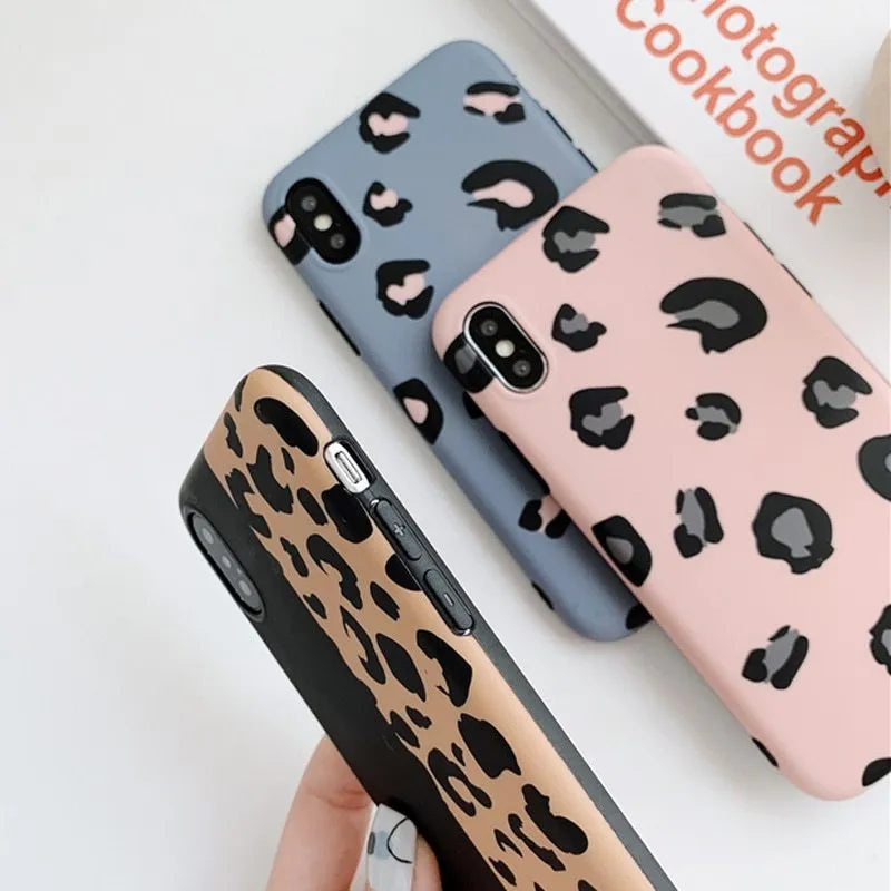 Leopard print pattern protective back cover case for iPhone, shown in black, blue, and pink colour options.