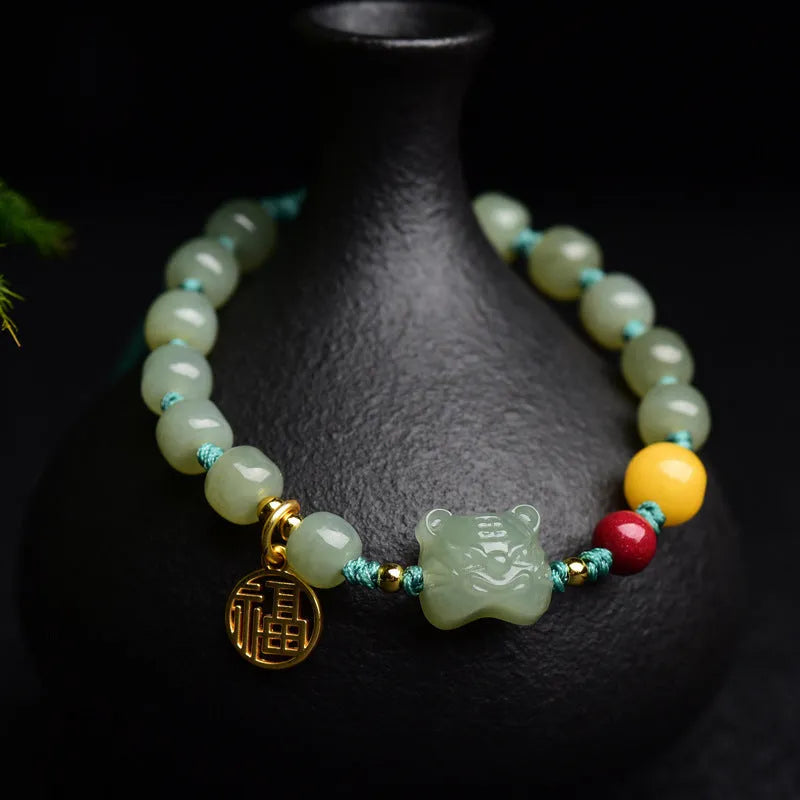 Natural Hetian Jade and cinnabar bracelet with beeswax beads and animal Zodiac charms