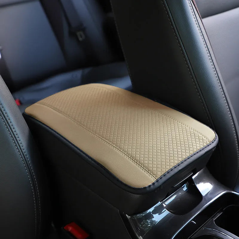 Black PU leather car armrest box cushion mat measuring 32 by 19 centimetres.