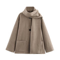 Women's longline polyester coat with an artificial fur collar in a street fashion style.