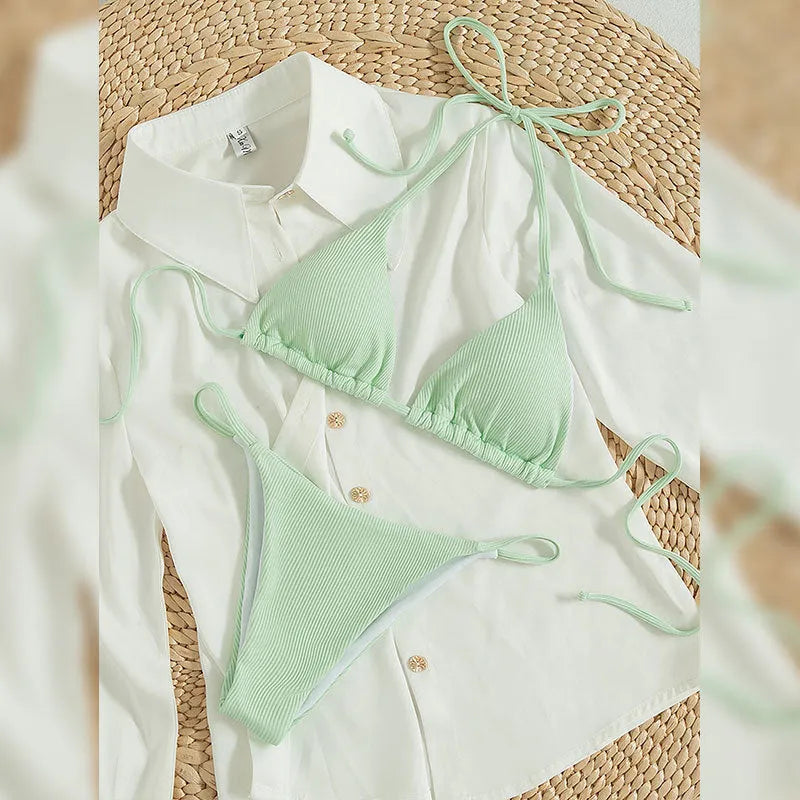 Women's lace up front tie bikini swimsuit on a hanger, showing adjustable detail and available in multiple colours.
