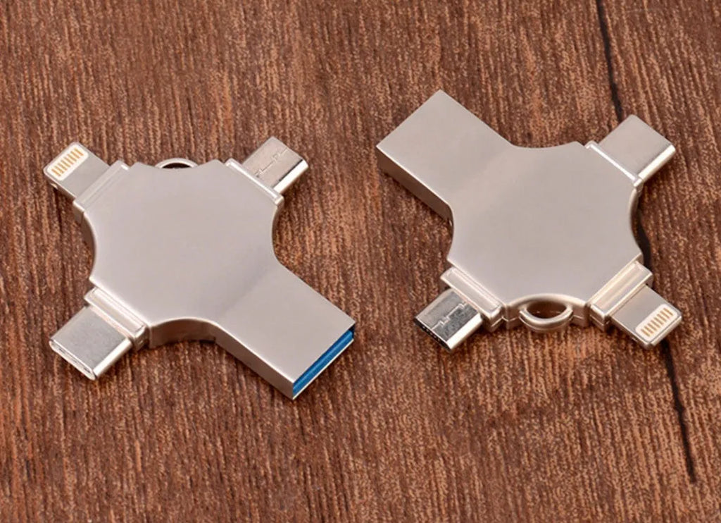 Silver metal 4-in-1 USB 3.0 flash drive with iOS, Micro USB, Type-C, and USB connectors for mobile phone and computer data transfer