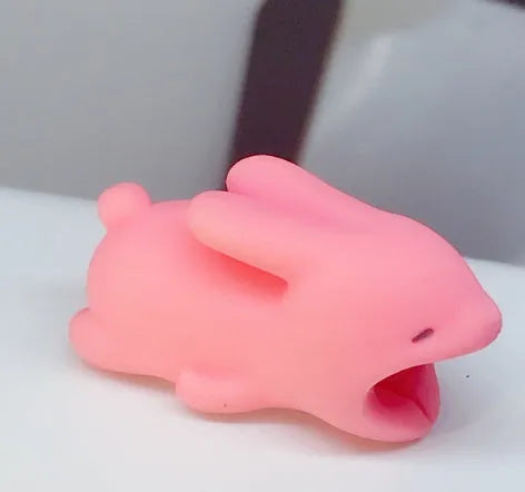 iPhone Lightning cable protector in an animal design, shown on the end of a charging cable.