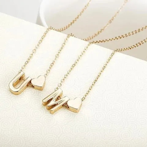 Peach heart shaped letter necklace pendant in gold and silver alloy finishes