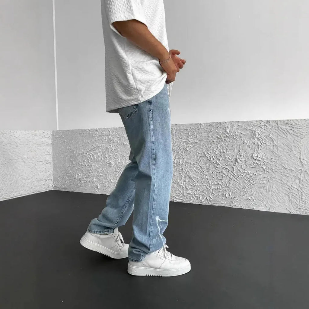 Men's straight-leg denim jeans with mid-waist design showing front view