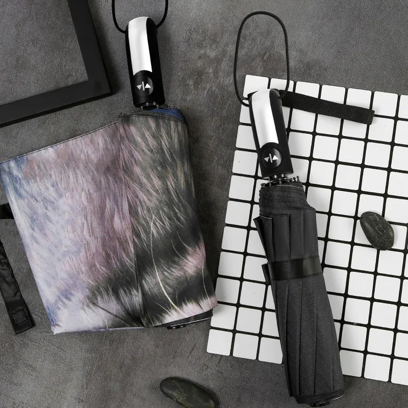 Tri-fold umbrella with eccentric gesture design, shown in folded and open states.