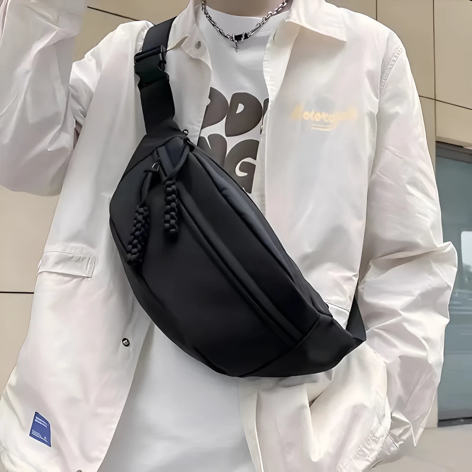 Men's black polyester chest bag shown as a crossbody bag with 35cm width