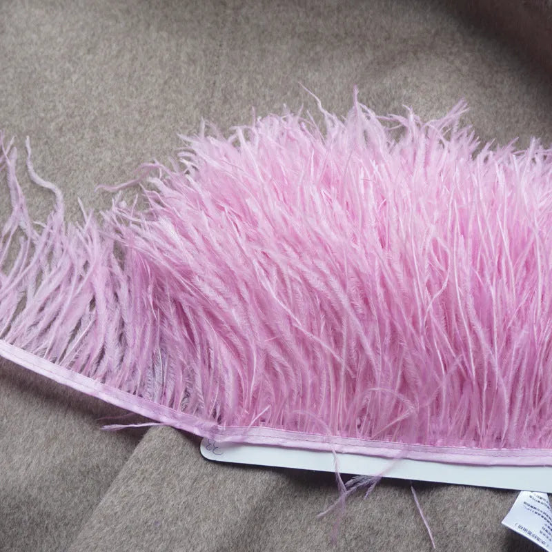 Decorative feather cloth strip in multiple colours including white, black, and mint green for DIY clothing and craft projects