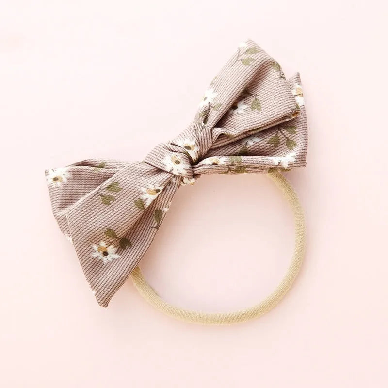 Children's cloth knotted bow hair ring in a Snow White princess design.