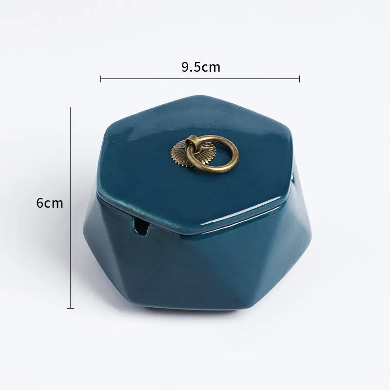 Ceramic ashtray with lid, Nordic style, available in multiple colours, on a tabletop
