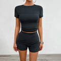 Women's solid colour viscose sports set with short sleeve t-shirt and elastic waist shorts.