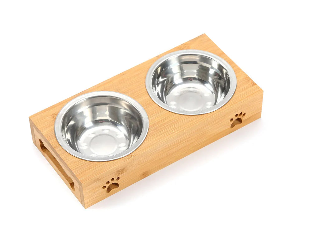 Solid wood pet feeding table with stainless steel bowls in a raised design for cats.
