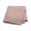 Solid colour baby blanket with raised 3D line texture, shown in beige khaki colour, laid flat to show 70cm by 90cm size.