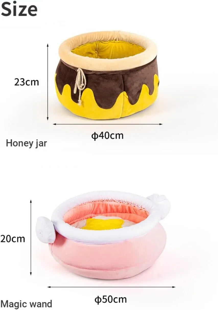 Pink or yellow honey pot-shaped enclosed cat bed with a magic wand decoration and a removable cushion.
