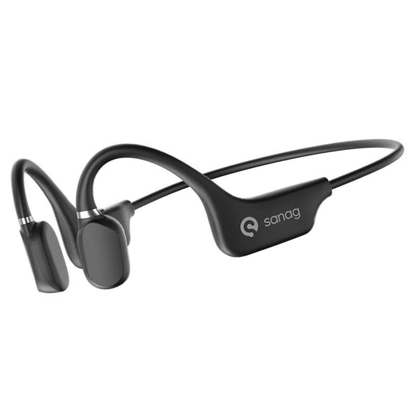 A person wearing black bone conduction Bluetooth headphones around their neck during a run.