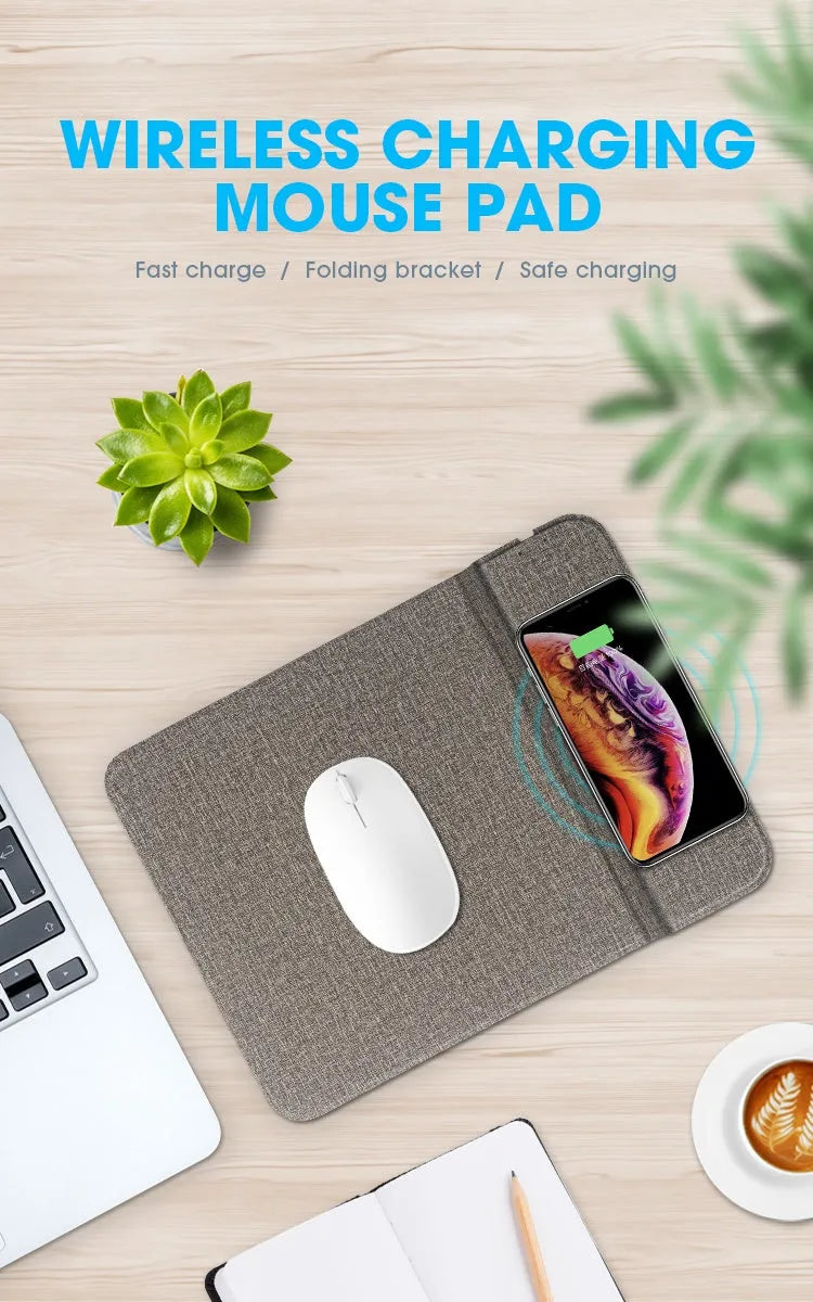 Grey foldable fabric phone holder with smartphone charging wirelessly on a wooden desk