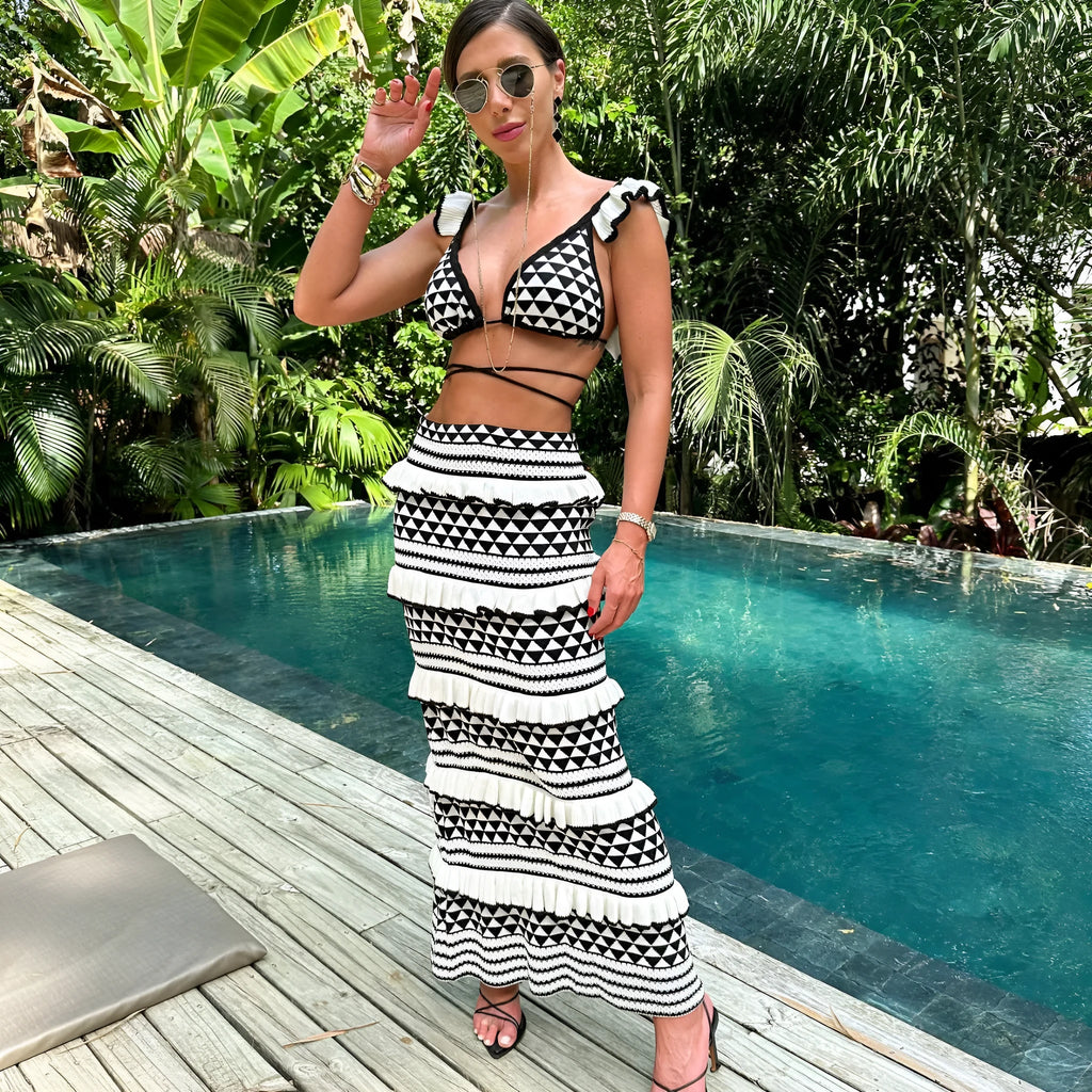 Women's black and white striped bikini top with ruffles and matching long knitted skirt set