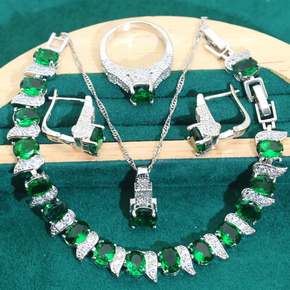 Bridal four-piece zircon jewellery set with necklace, bracelet, earrings and ring in water wave chain design.
