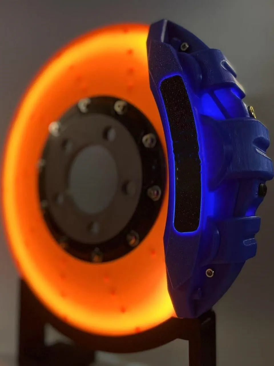 Brake disc design rechargeable LED night light with touch control in blue, red or yellow.