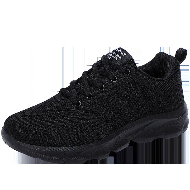 Women's white mesh leisure shoes with lace-up closure and low heel on neutral background