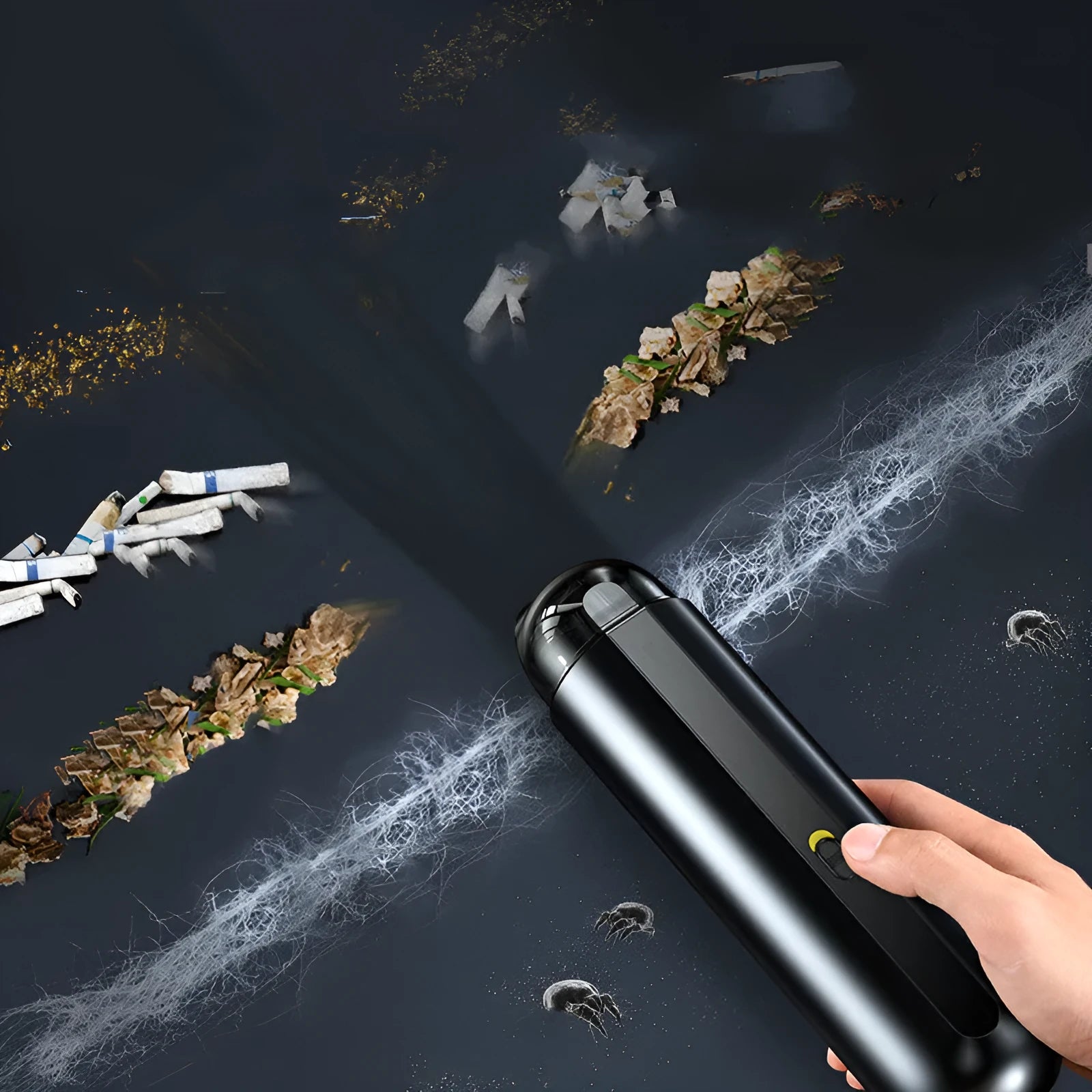 Starry sky black handheld car vacuum cleaner with a blowing hose attachment on a car seat.