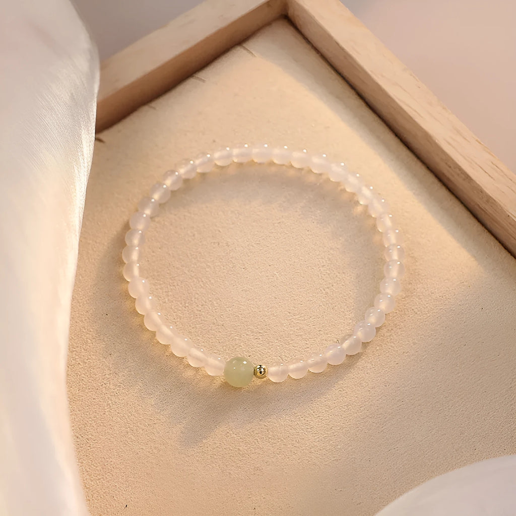 Natural white agate women's bracelet on wrist showing handmade beads and 15cm length.