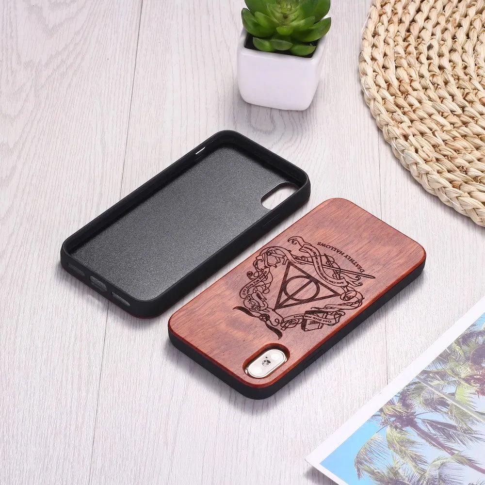 Wooden phone case with laser-carved back and black TPU frame for iPhone.