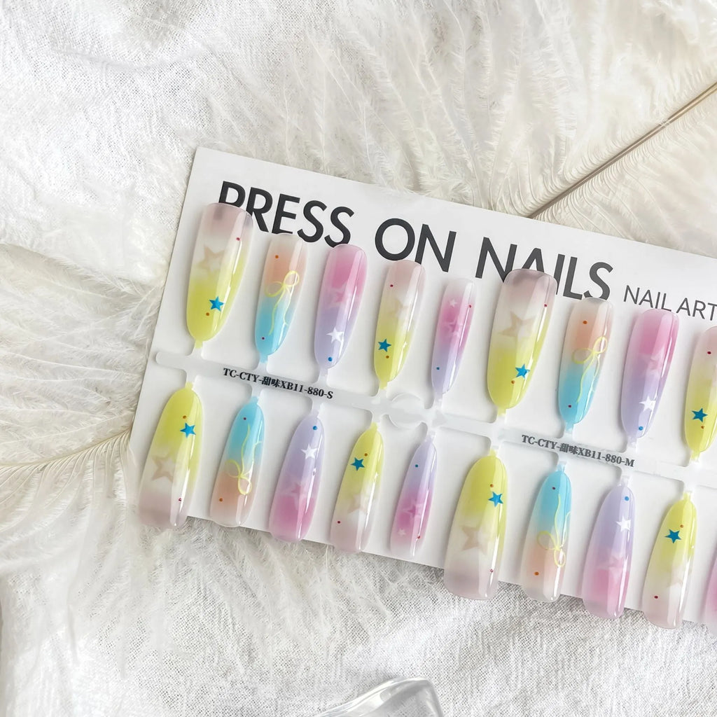 Dopamine Cartoon XINGX oval almond nail sticker set in sweet XB11-880 colour, natural frosted non-sealing layer, on a woman's nails.