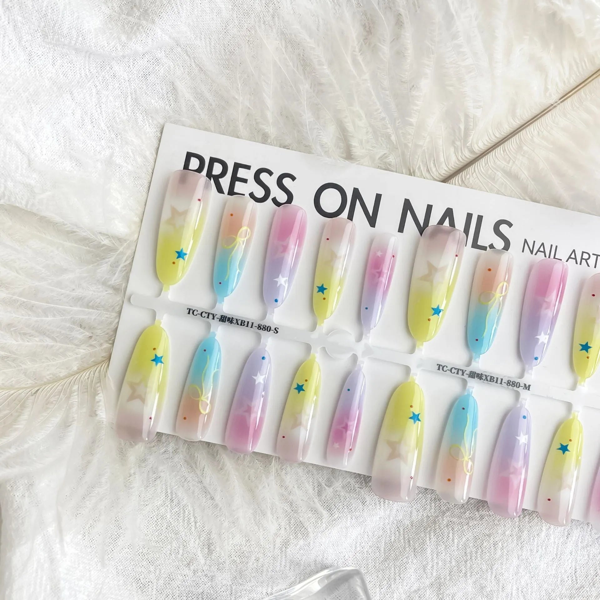 Dopamine Cartoon XINGX oval almond nail sticker set in sweet XB11-880 colour, natural frosted non-sealing layer, on a woman's nails.