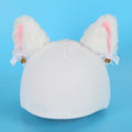Soft plush cartoon character cover stretched over a pair of black on-ear headphones.