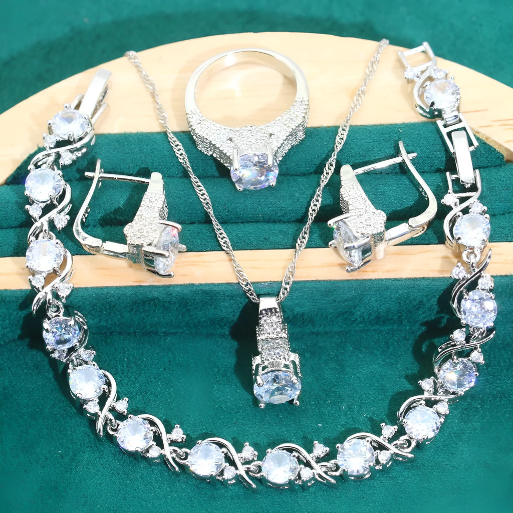 Bridal four-piece zircon jewellery set with necklace, bracelet, earrings and ring in water wave chain design.
