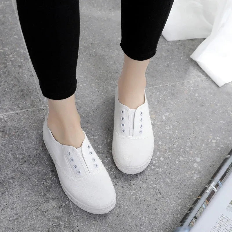 Low-top canvas casual shoes in black, grey, pink, and white colours with flat plastic soles
