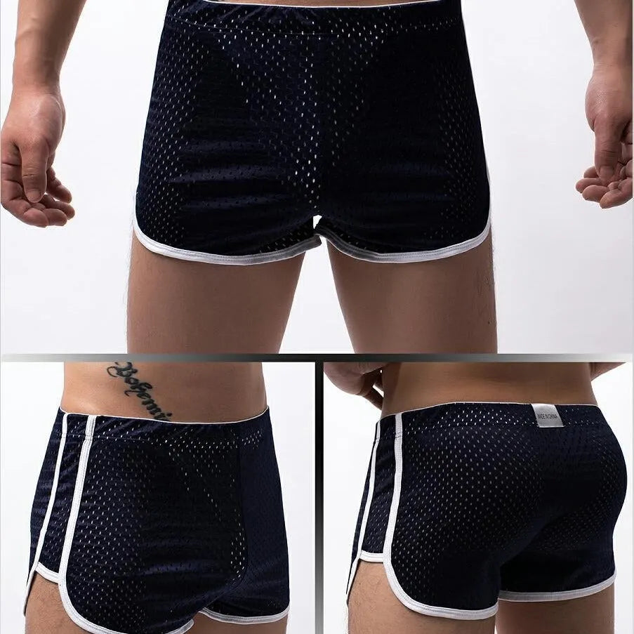 Men's black three-point boxer shorts with a mid-waistband, made from a breathable cotton and nylon fabric blend.