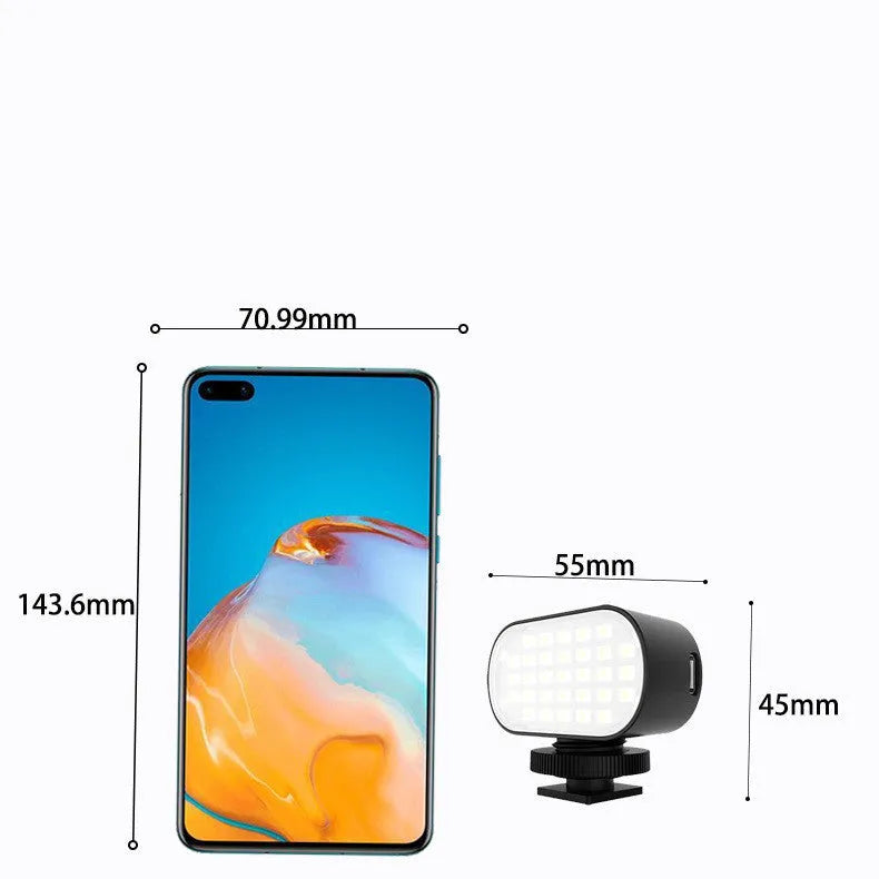 Black ST-30 mobile phone fill light with digital display, cold shoe mount, and included silicone diffuser.