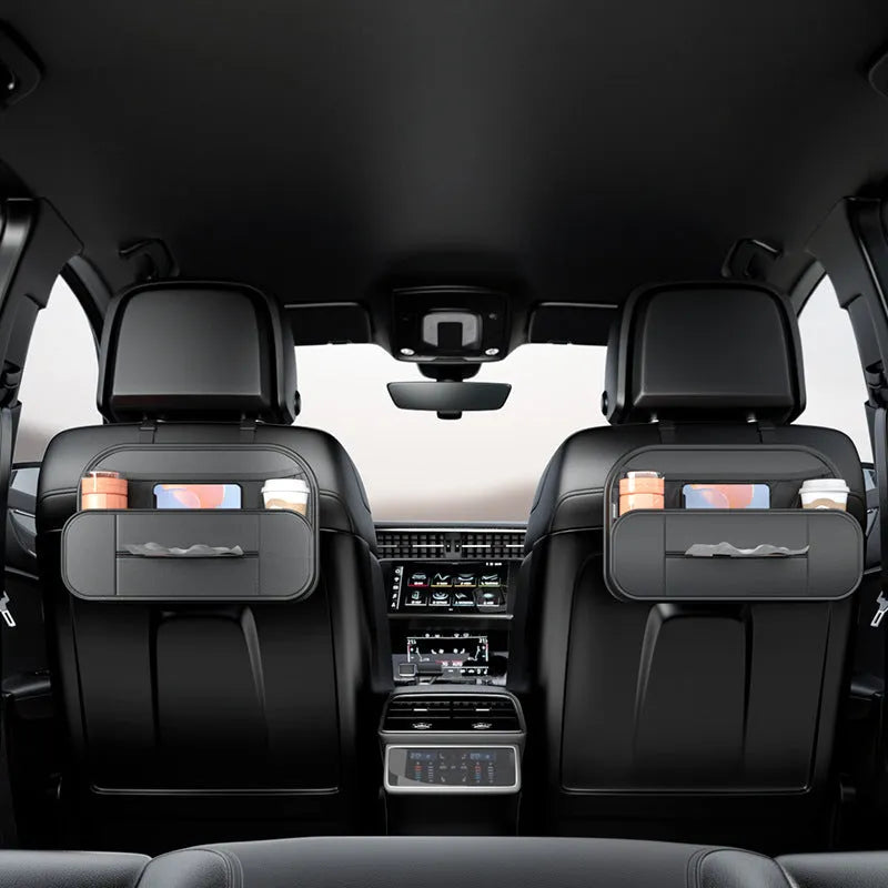 Black leather car seat storage bag with customisable compartments mounted on vehicle seatback