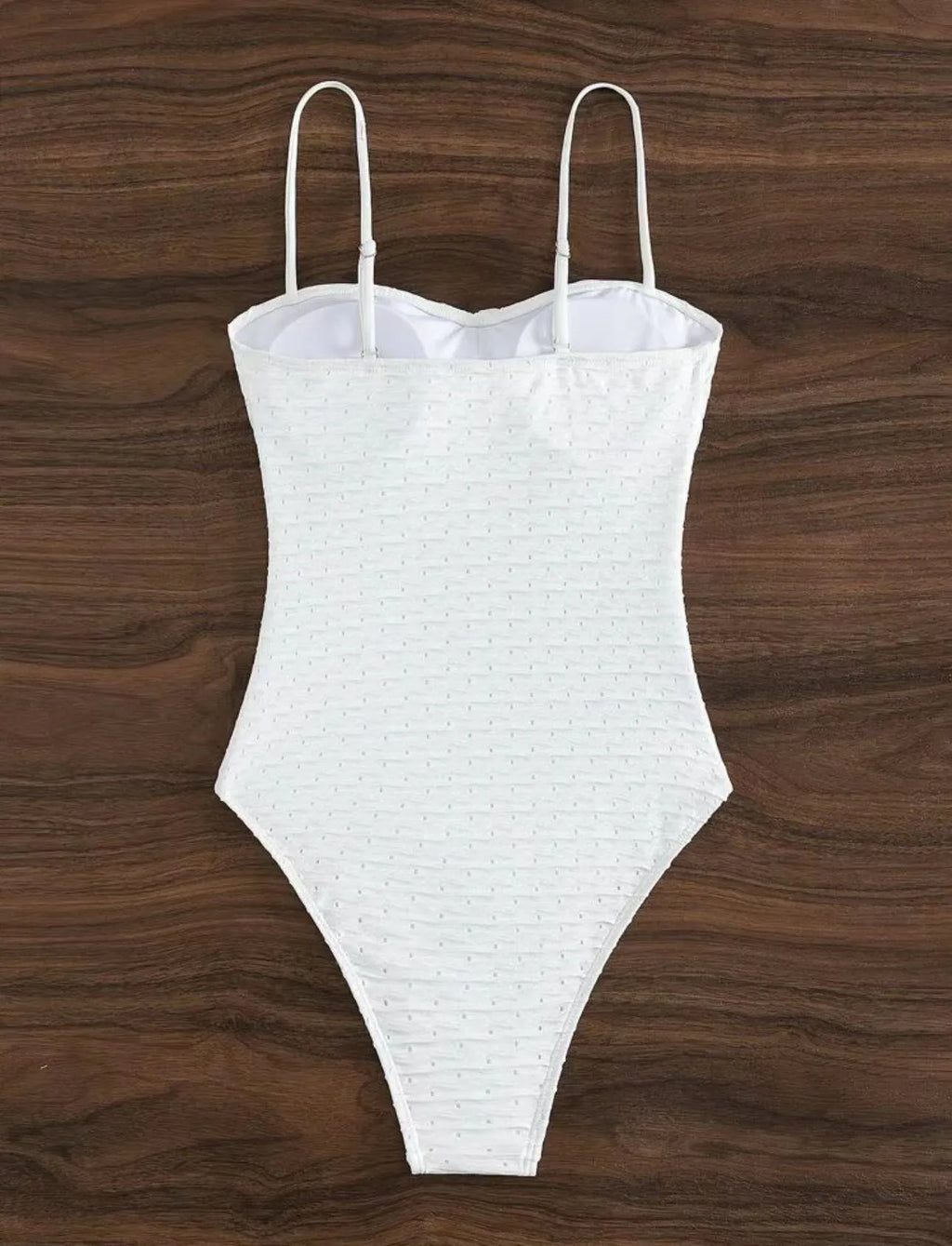 White women's one-piece swimsuit with briefs style on a mannequin