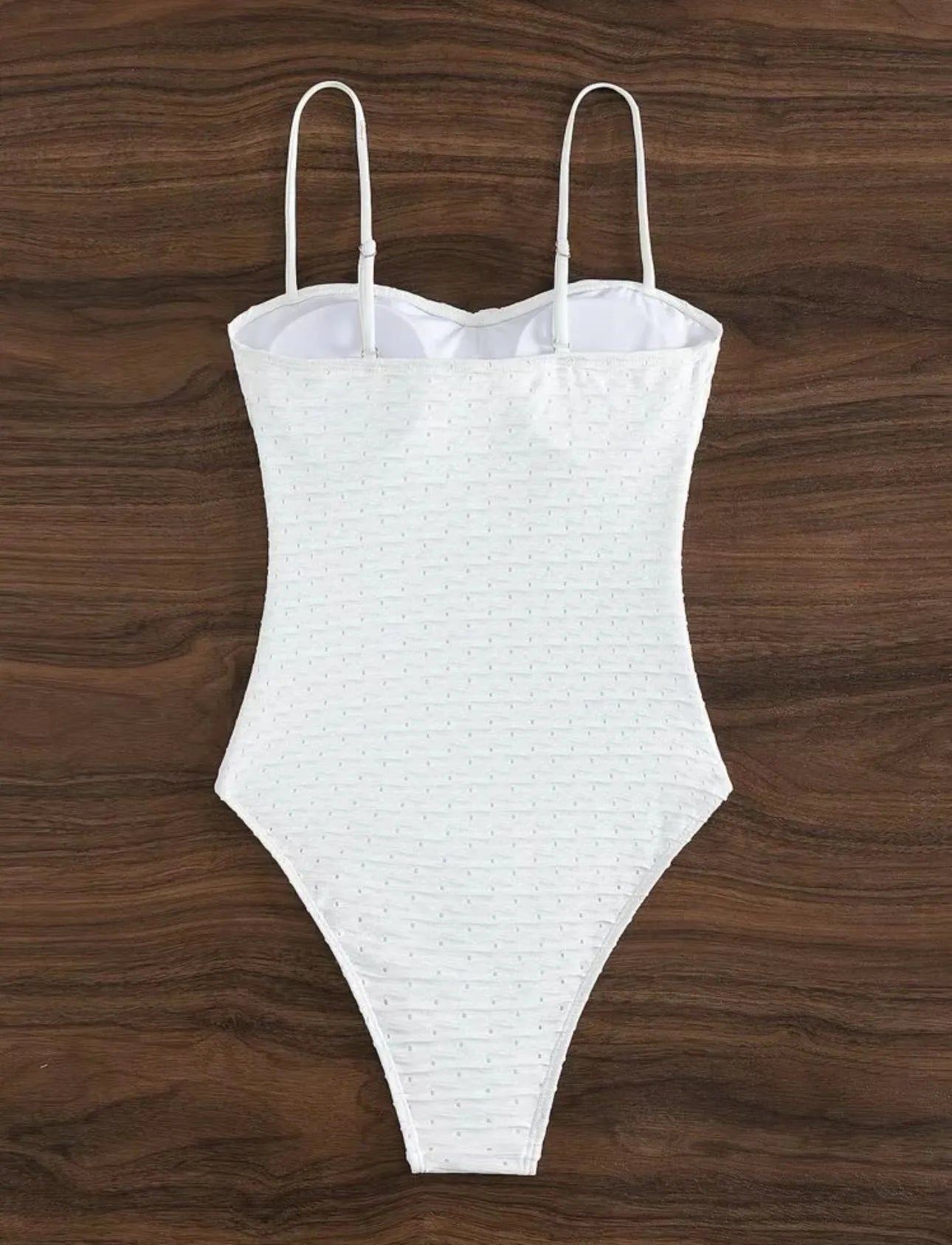 White women's one-piece swimsuit with briefs style on a mannequin