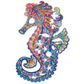 Irregular three-dimensional seahorse shaped wooden puzzle on a flat surface with colour options A3 A4 A5