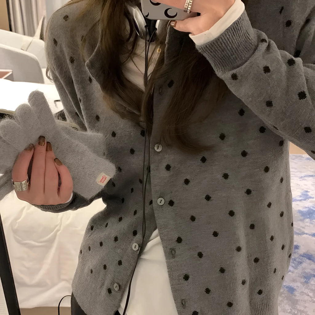 Women's grey dot pattern knitted cardigan with crocheted flower details on front
