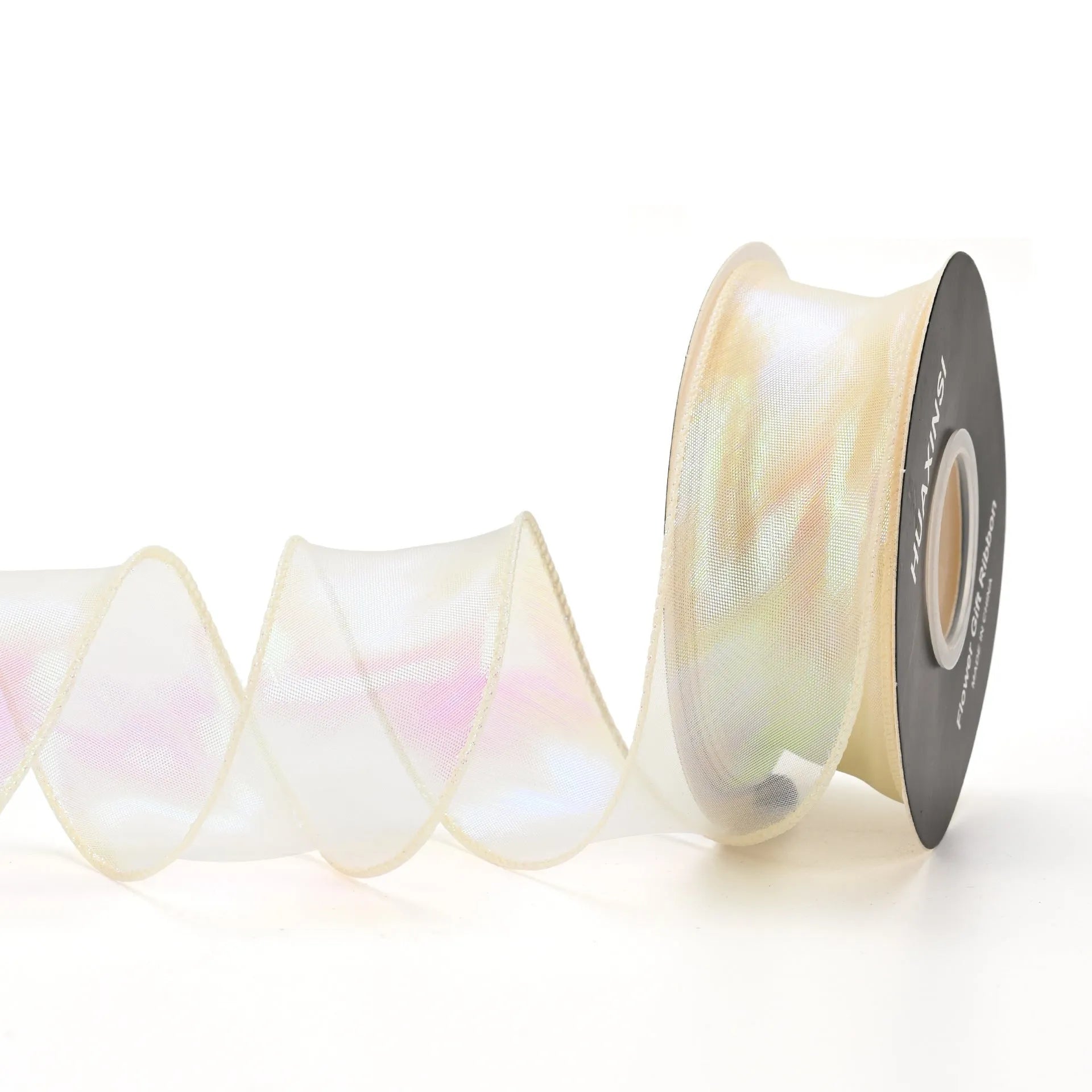 Roll of colourful wave patterned fishtail yarn decorative ribbon in mesh material, 4cm wide.