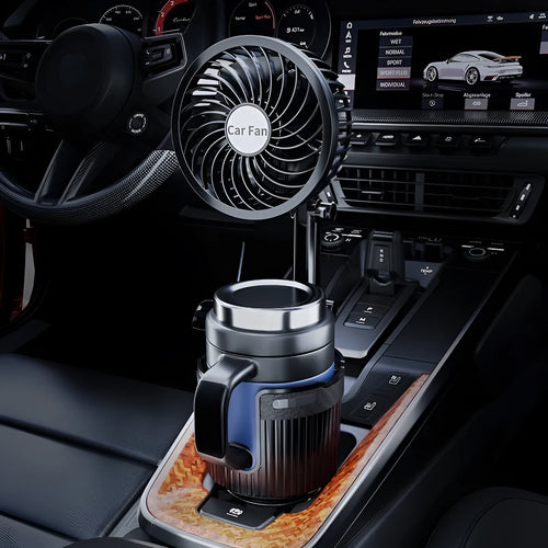 A car cup holder fan with black ABS plastic housing inserted into a vehicle's centre console.